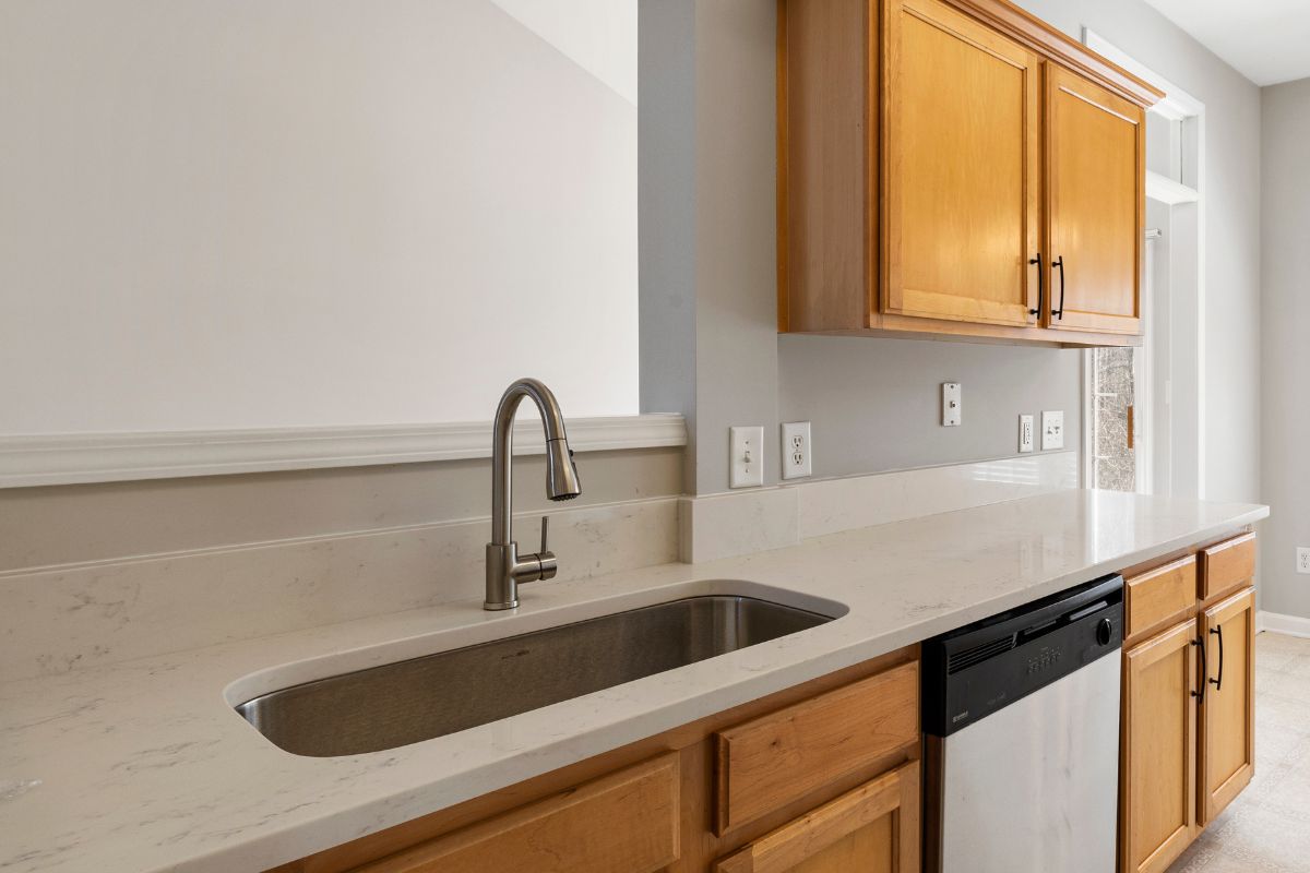marble kitchen counter top with wooden cabinet
